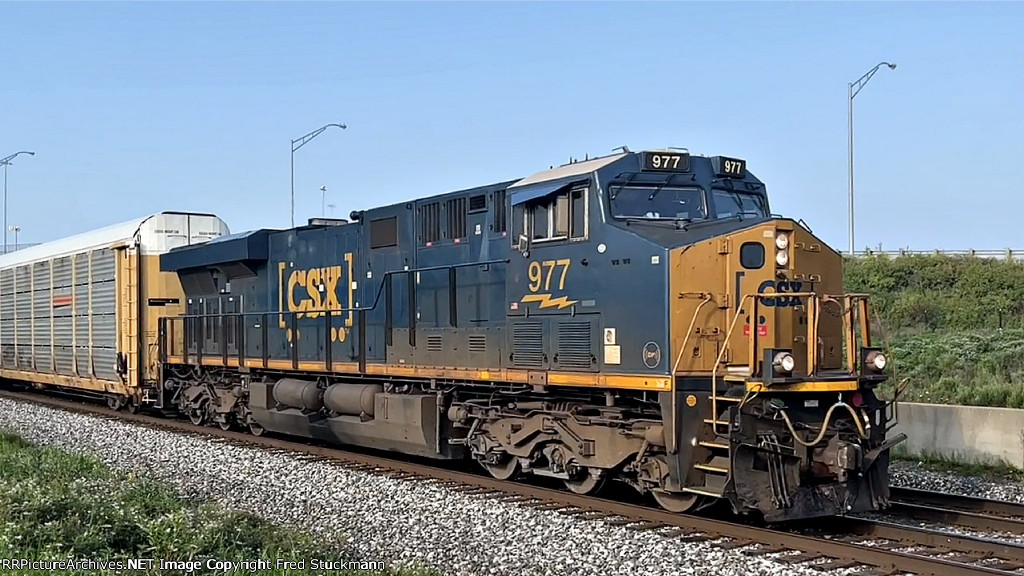 CSX 977 leads M214.